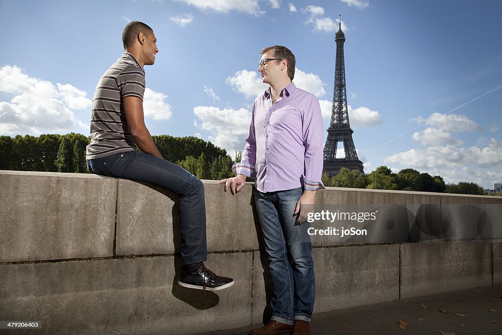 To man talking, Eiffel Tower in backgrounds