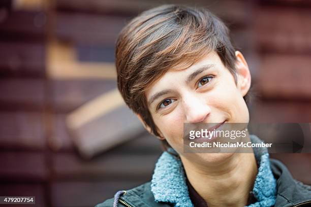 beautiful cheerful young androgynous british woman kind smile - androgynous stock pictures, royalty-free photos & images