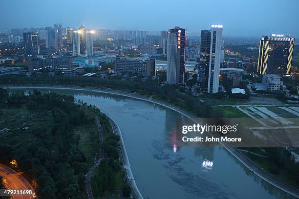 Apartment buildings rise into the skyline June 29, 2015 in Chengdu, China. First inhabited more than 4 thousand years ago, Chengdu now has more than...