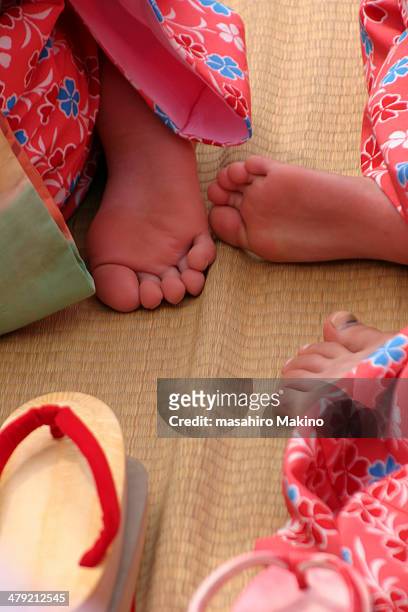 little girls' feet in kimono - feet girl stock pictures, royalty-free photos & images
