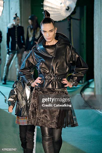Model walks the runway at the Jean Paul Gaultier Autumn Winter 2014 fashion show during Paris Fashion Week on March 1, 2014 in Paris, France.