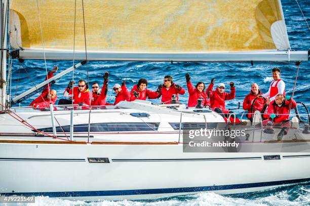 sailing crew on sailboat during regatta - yacht club stock pictures, royalty-free photos & images