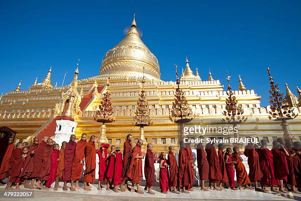 Buddhist novices in front of the Shwezigon pagoda during a festival in Bagan or Pagan, Burma or also called Myanmar.