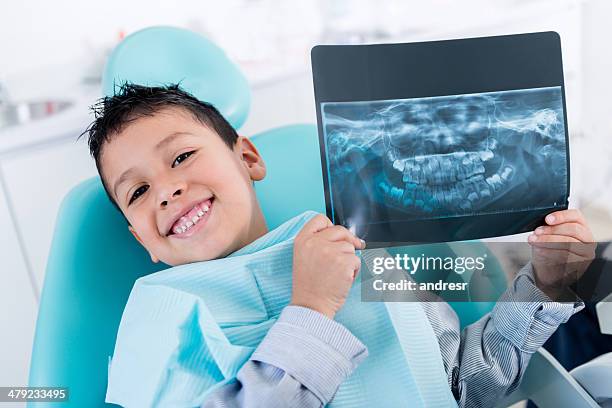 boy with an x-ray - pediatric dentist stock pictures, royalty-free photos & images