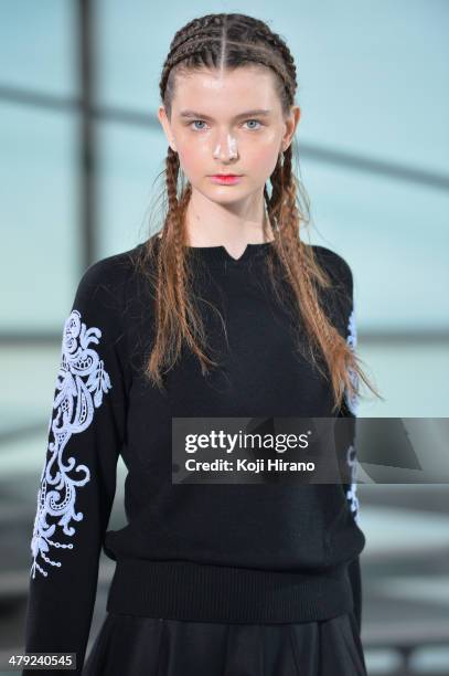 Model showcases designs on the runway during the LAMARCK show as part of Mercedes Benz Fashion Week TOKYO 2014 A/W at Shibuya Hikarie on March 17,...