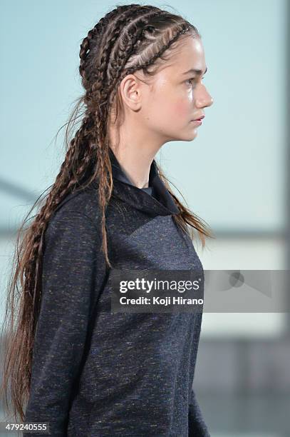 Model showcases designs on the runway during the LAMARCK show as part of Mercedes Benz Fashion Week TOKYO 2014 A/W at Shibuya Hikarie on March 17,...