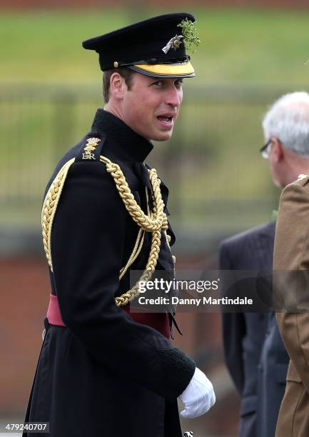 Prince William, Duke of Cambridge attends the St Patrick's Day parade at Mons Barracks on March 17, 2014 in Aldershot, England. Catherine, Duchess of...