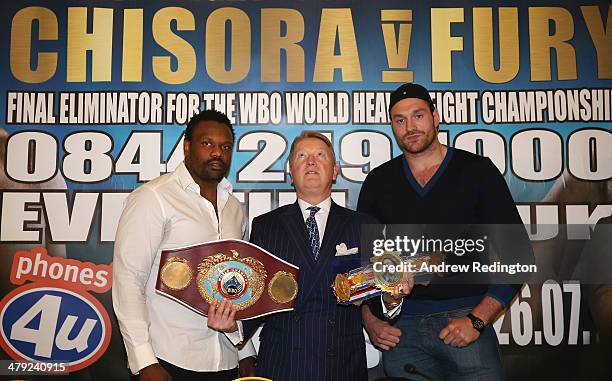 Dereck Chisora and Tyson Fury pose with promoter Frank Warren during a press conference to announce a final eliminator for the WBO world heavyweight...