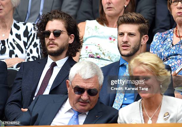 Kit Harington and Adam Lallana attend the Christina McHale v Sabine Lisicki match on day four of the Wimbledon Tennis Championships at Wimbledon on...