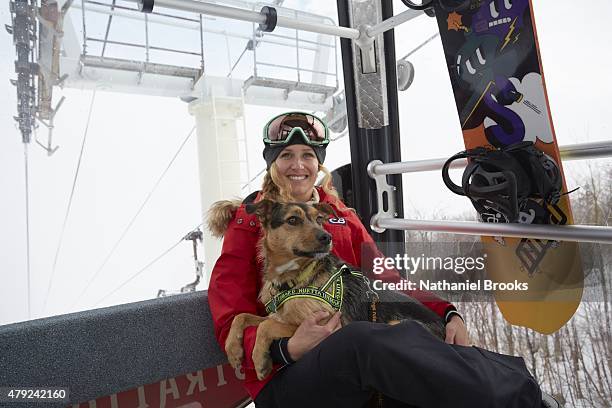 Where Are They Now: Portrait of Olympic snowboarder Lindsey Jacobellis posing with her dog, Sochi, during photo shoot at Stratton Mountain Resort....