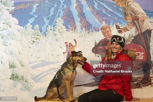 Where Are They Now: Portrait of Olympic snowboarder Lindsey Jacobellis posing with her dog, Sochi, during photo shoot at Stratton Mountain Resort....