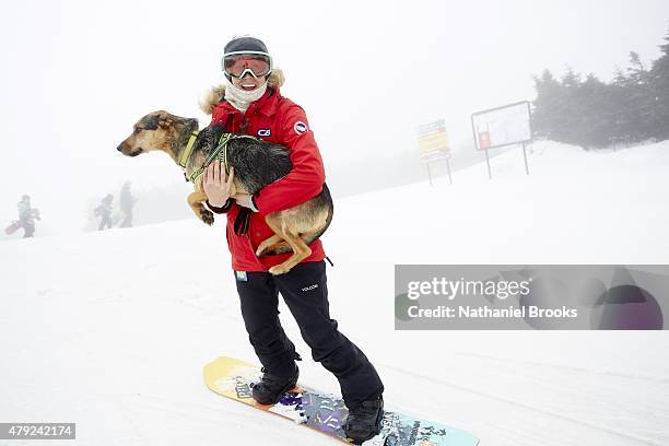 Where Are They Now: Portrait of Olympic snowboarder Lindsey Jacobellis posing with her dog, Sochi, during photo shoot at Stratton Mountain Resort....