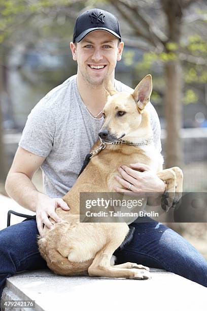 Where Are They Now: Portrait of New York Rangers center Derek Stepan with his dog Jake during photo shoot in Riverside Park. Stepan received Jake...