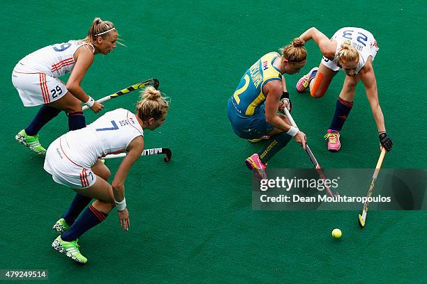 Willemijn Bos, Jacky Schoenaker and Margot Van Geffen of the Netherlands battle for the ball with Georgia Nanscawen of Australia during the Fintro...