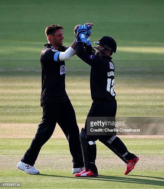 Craig Cachopa of Sussex celebrates with Steffan Piolet as he catches out Eoin Morgan of Middlesex during the NatWest T20 Blast match between...