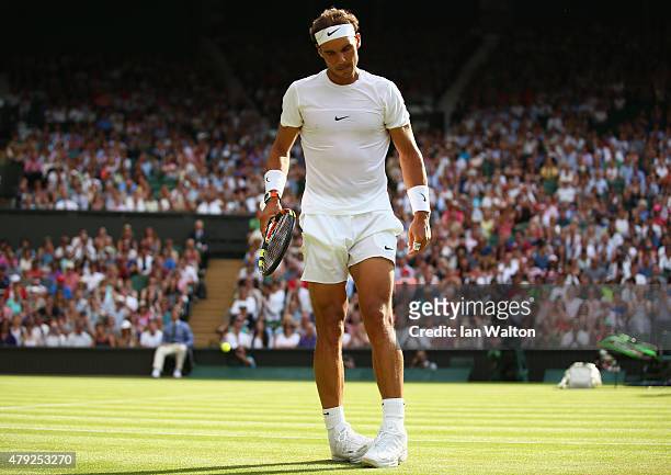 Rafael Nadal of Spain looks dejected in his Gentlemens Singles Second Round match against Dustin Brown of Germany during day four of the Wimbledon...