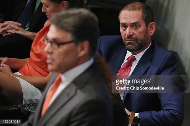 Jeff Miller , campaign manager for former Texas Governor Rick Perry's 2016 presidential bid, listens to Perry address the National Press Club...
