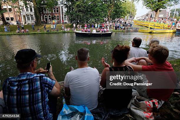 Fans watch as Lampre-Merida take a canal boat to team presentation ahead of the 2015 Tour de France on July 2, 2015 in Utrecht, The Netherlands.