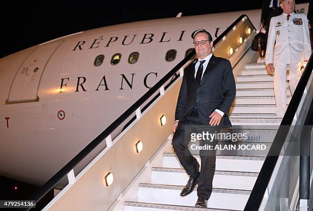 French President Francois Hollande arrives at Quatro de Fevereiro airport in Luanda on July 2, 2015. Hollande is on a three-day state visit to Africa...