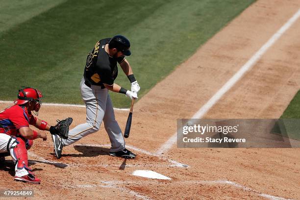 Brent Morel of the Pittsburgh Pirates swings at a pitch in the fourth inning of a game against the Philadelphia Phillies at Bright House Field on...