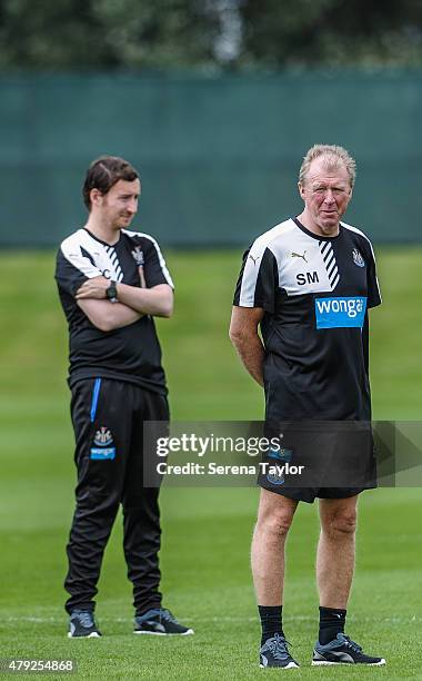 Head Coach Steve McClaren and Assistant Coach Ian Cathro stand on the pitch during the Newcastle United Pre-Season Training session at The Newcastle...