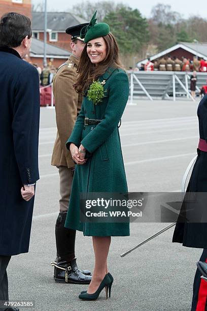 Catherine, Duchess of Cambridge smiles as she visits the 1st Battalion Irish Guards during the St Patrick's Day parade at Mons Barracks on March 17,...