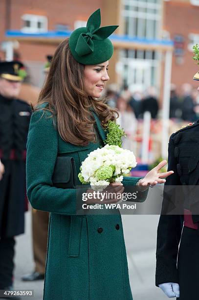 Catherine, Duchess of Cambridge smiles as she visits the 1st Battalion Irish Guards during the St Patrick's Day parade at Mons Barracks on March 17,...