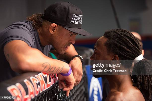 Jason Jackson talks to his teammate Vitor Belfort before facing Michael Graves during the filming of The Ultimate Fighter: American Top Team vs...