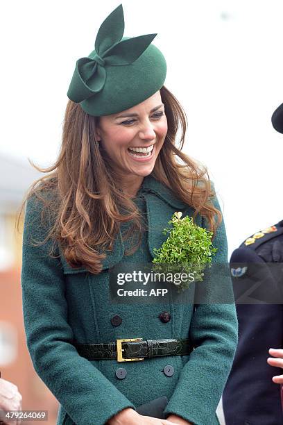 Catherine, Duchess of Cambridge looks on while visiting the Irish Guards during a St Patrick's Day parade in Mons Barracks in Aldershot on March 17,...