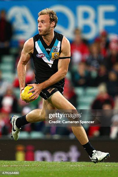 Jack Hombsch of the Power runs the ball during the round 14 AFL match between the Sydney Swans and the Port Adelaide Power at SCG on July 2, 2015 in...