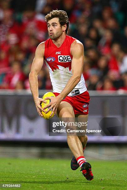 Nick Smith of the Swans runs the ball during the round 14 AFL match between the Sydney Swans and the Port Adelaide Power at SCG on July 2, 2015 in...