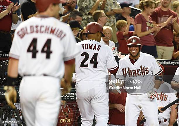 Yasmany Tomas of the Arizona Diamondbacks is greeted by teammate Welington Castillo after hitting a two run home run during the sixth inning against...