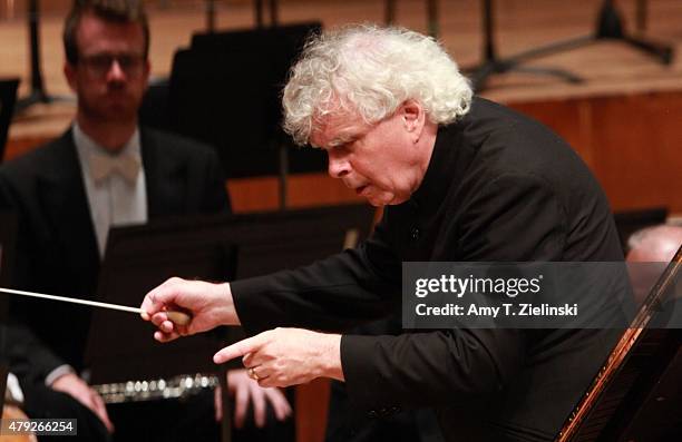 Conductor Sir Simon Rattle leads the London Symphony Orchestra and polish pianist Krystian Zimerman to Brahms's First Piano Concerto at Barbican...