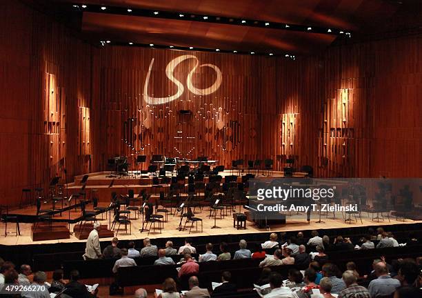 People take their seats before the London Symphony Orchestra prepares to be lead by conductor Sir Simon Rattle with polish pianist Krystian Zimerman...