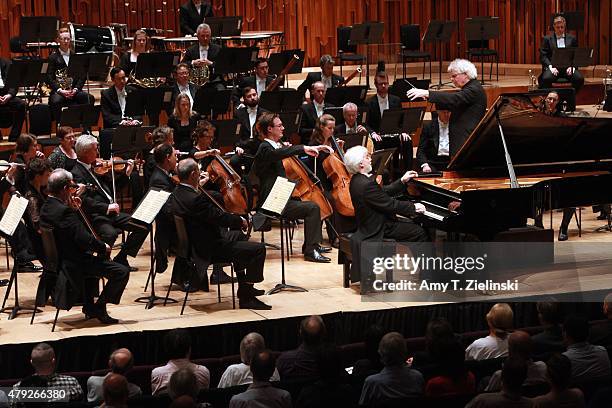 Polish pianist Krystian Zimerman performs Brahms's First Piano Concerto with conductor Sir Simon Rattle leading the London Symphony Orchestra at...