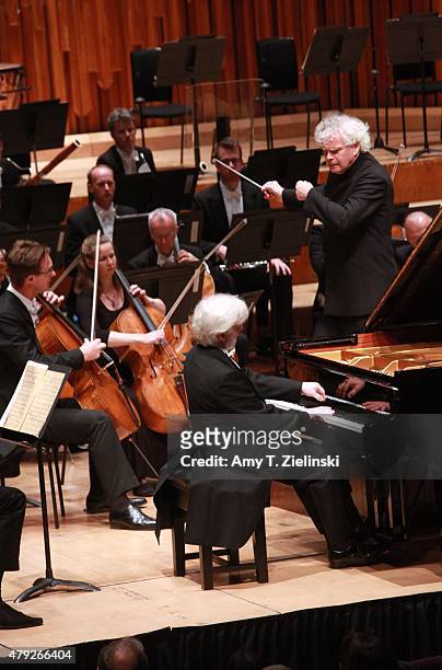 Polish pianist Krystian Zimerman performs Brahms's First Piano Concerto with conductor Sir Simon Rattle leading the London Symphony Orchestra at...