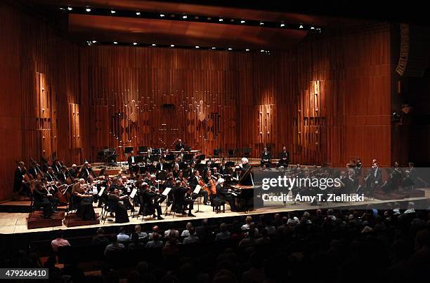 Polish pianist Krystian Zimerman performs Brahms's First Piano Concerto with conductor Sir Simon Rattle leading the London Symphony Orchestra at...