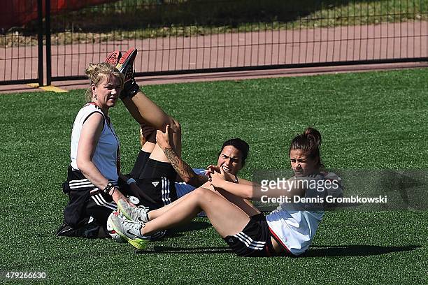 Dzsenifer Marozsan and Lena Lotzen of Germany practice during a training session on July 2, 2015 in Edmonton, Canada.