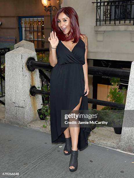 Nicole 'Snooki' Polizzi poses for a photo showing her new hair color in front of the Vidov Salon on July 2, 2015 in New York City.