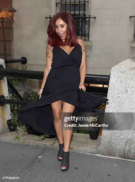 Nicole 'Snooki' Polizzi poses for a photo showing her new hair color in front of the Vidov Salon on July 2, 2015 in New York City.