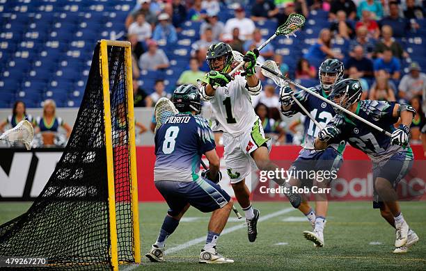 JoJo Marasco of the New York Lizards scores on goalie Tyler Fiorito of the Chesapeake Bayhawks during the first quarter at Navy-Marine Corps Memorial...