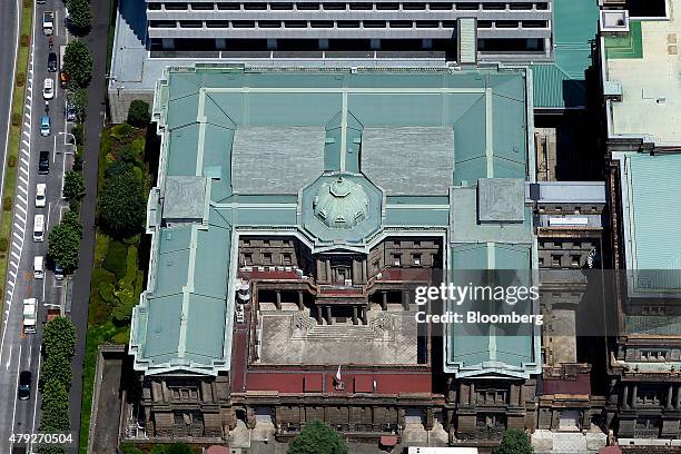 The Bank of Japan headquarters stands in this aerial photograph taken in Tokyo, Japan, on Wednesday, June 24, 2015. The Abe administration aims to...