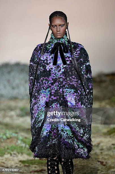 Model walks the runway at the Alexander McQueen Autumn Winter 2014 fashion show during Paris Fashion Week on March 4, 2014 in Paris, France.