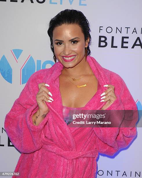 Demi Lovato poses at the Y-100 cool for the summer pool party held at the Fontainebleau on July 2, 2015 in Miami Beach, Florida.