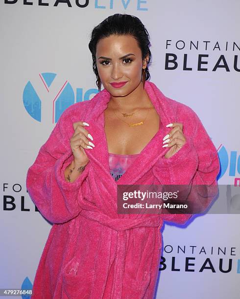 Demi Lovato poses at the Y-100 cool for the summer pool party held at the Fontainebleau on July 2, 2015 in Miami Beach, Florida.