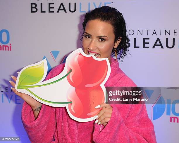 Demi Lovato poses at the Y-100 cool for the summer pool party held at the Fontainebleau on July 2, 2015 in Miami Beach, Florida.