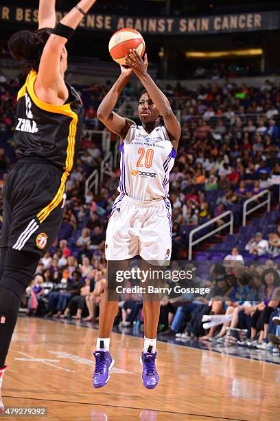 Shameka Christon of the Phoenix Mercury shoots against Amanda Zahui B of the Tulsa Shock on July 2, 2015 at Talking Stick Resort Arena in Phoenix,...