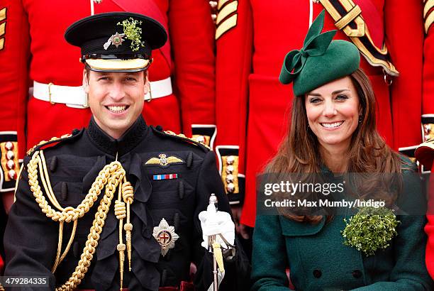 Prince William, Duke of Cambridge and Catherine, Duchess of Cambridge pose for a group photograph with soldiers of the Irish Guards as they attend...