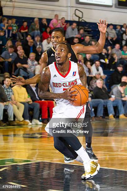 Tyshawn Taylor of the Maine Red Claws drives against the Erie BayHawks on March 16, 2014 at the Portland Expo in Portland, Maine. NOTE TO USER: User...