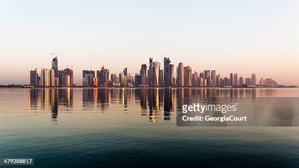doha city qatar at sunrise - dhow qatar stock pictures, royalty-free photos & images